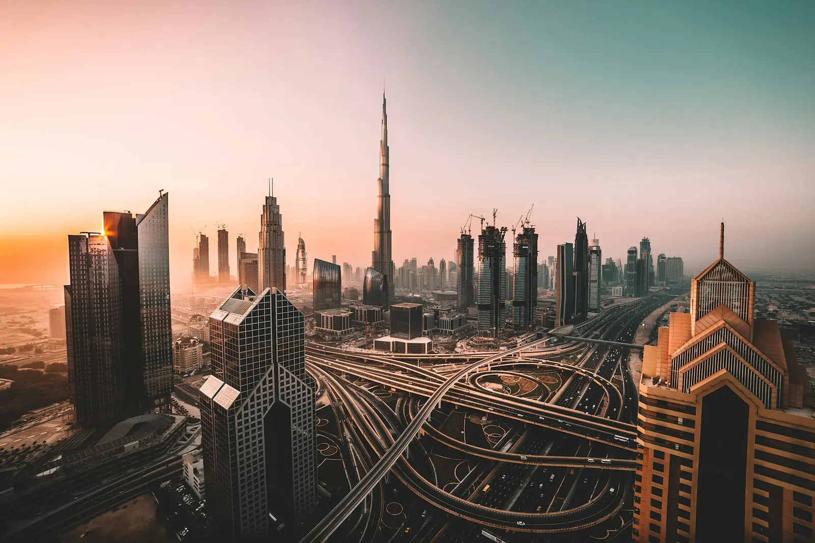 Dubai skyline and a highway interchange at dusk