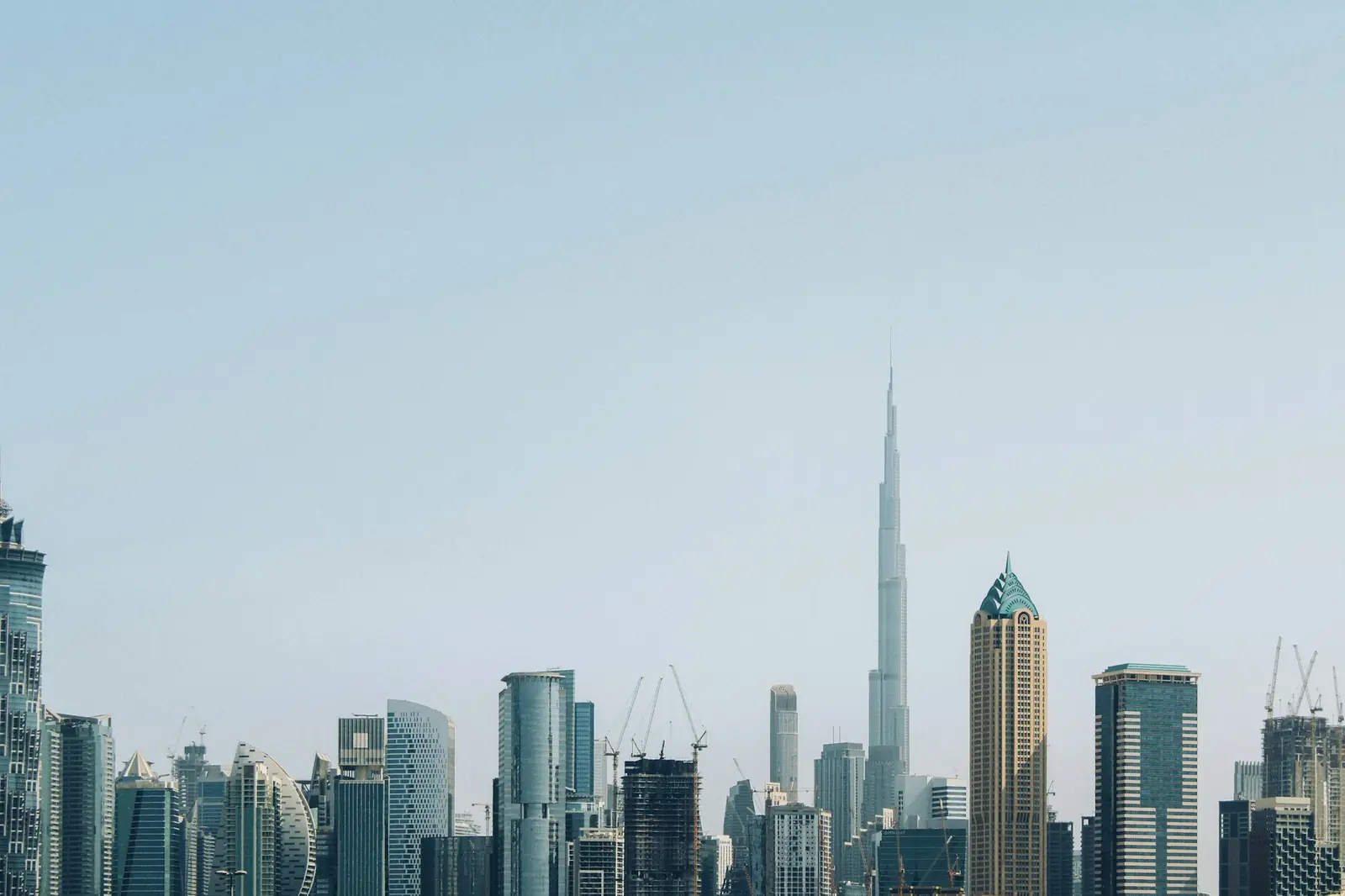 Dubai skyline with the Burj Khalifa under a clear blue sky